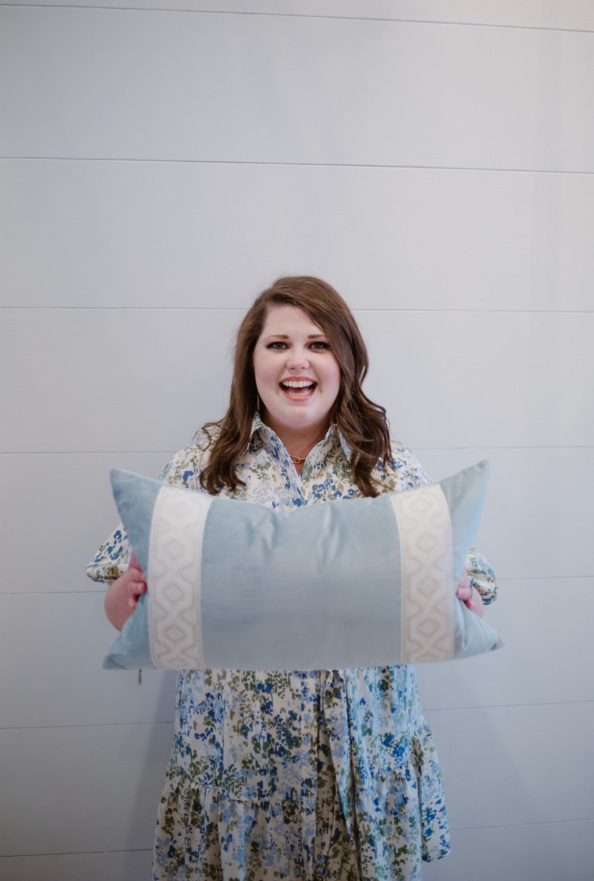 woman holding custom pillow from Lauren Egger Designs