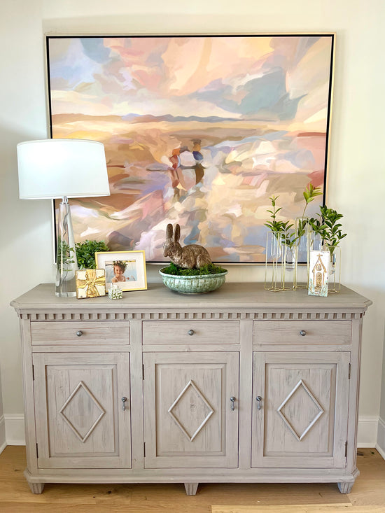 Entryway table with painting and furnishings chosen by Lauren Egger Designs.